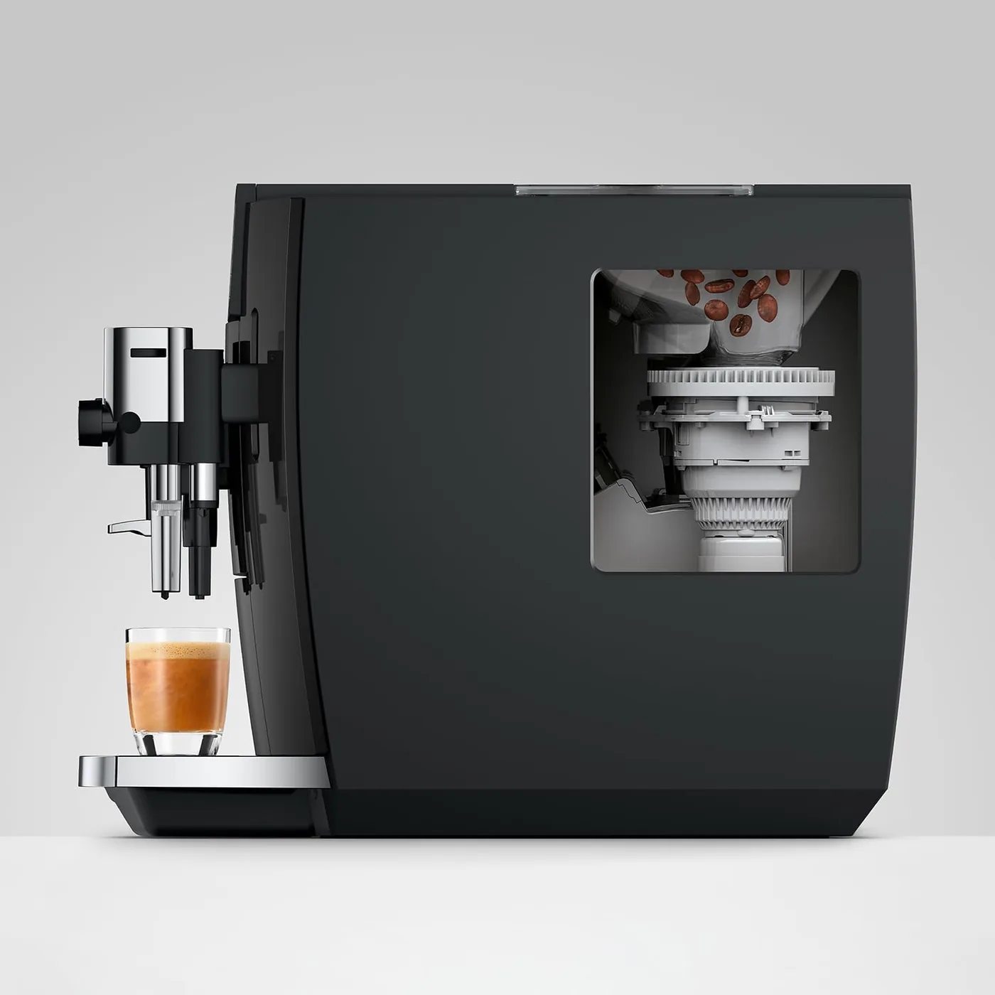 Cutaway view of the Jura E8 P.A.G.2 grinder with beans entering the burrs