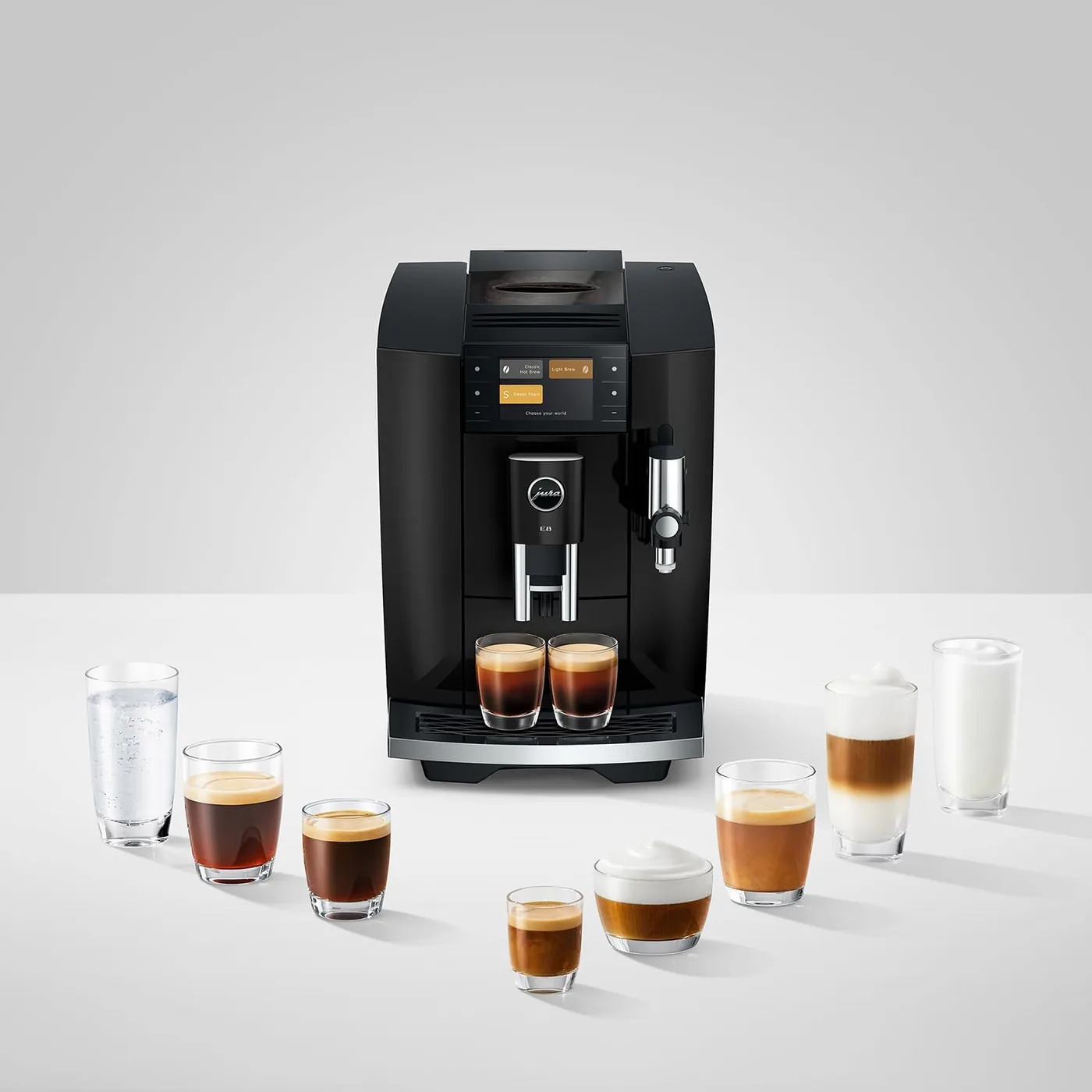 Jura E8 display showing the three drink worlds, Classic Hot Brew, Light Brew and Sweet Foam, with the full drink lineup in front