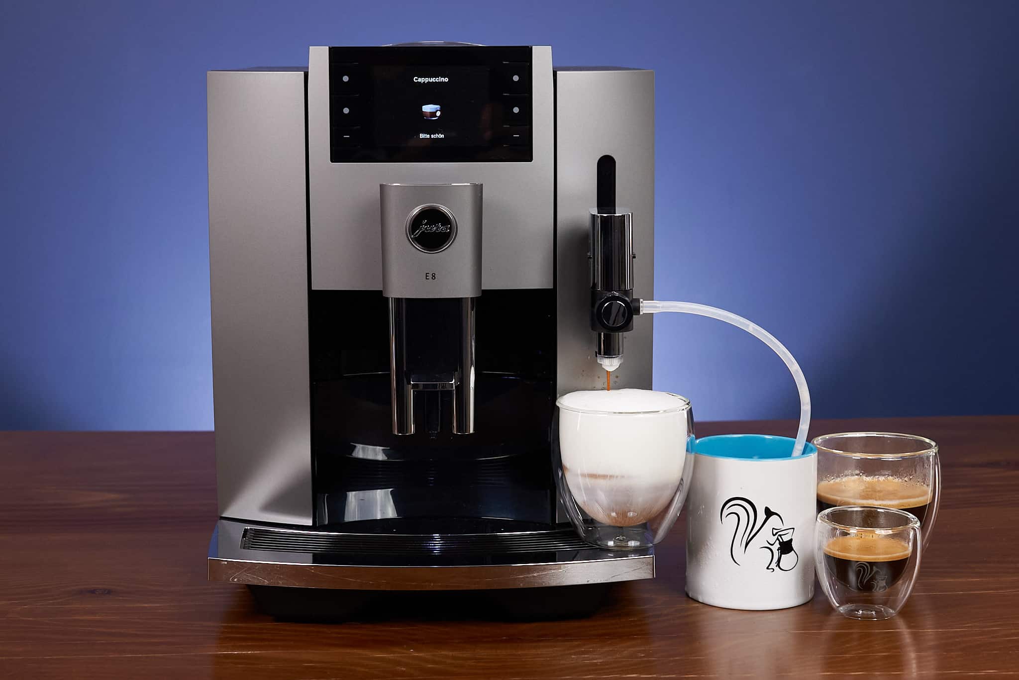 Jura E8 angled front with two espresso glasses