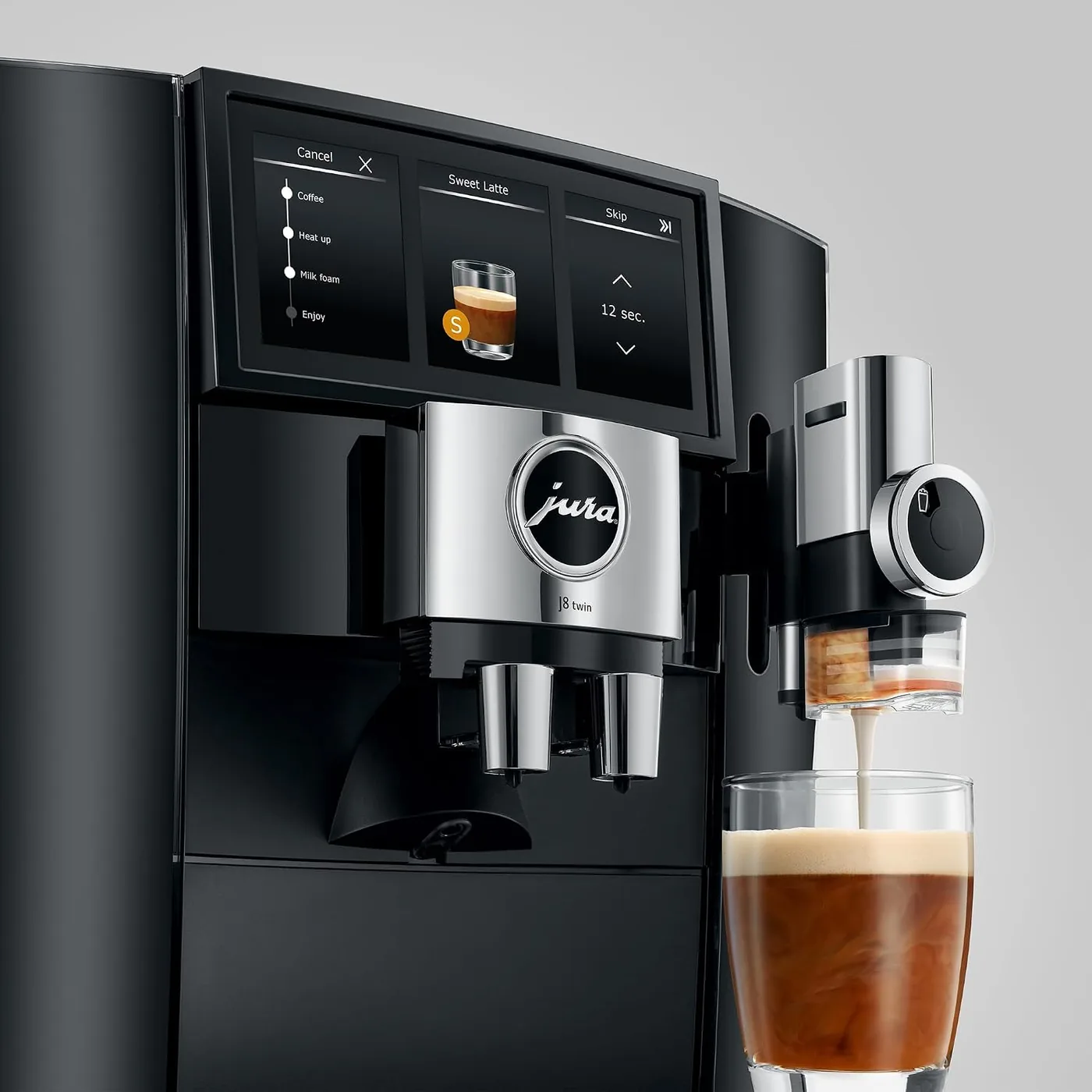 Close-up of the Jura J8 twin 6.7-inch Panorama Coffee Panel while the machine pours a drink